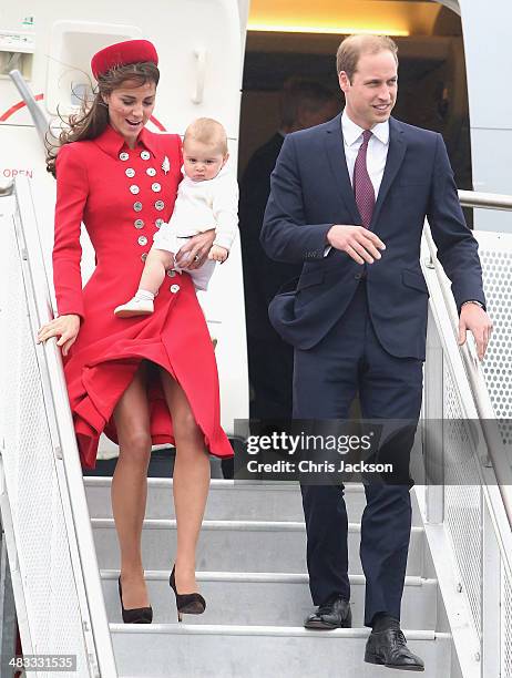 Catherine, Duchess of Cambridge, Prince William, Duke of Cambridge and Prince George of Cambridge arrive at Wellington Military Terminal on an RNZAF...