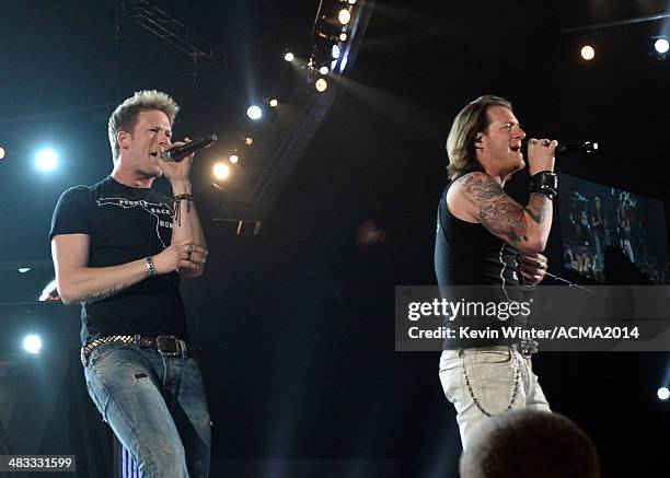 Singers Brian Kelley and Tyler Hubbard of Florida Georgia Line perform onstage during ACM Presents: An All-Star Salute To The Troops at the MGM Grand...
