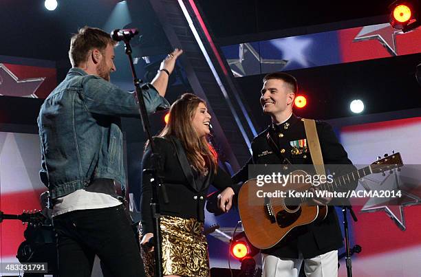 Musicians Charles Kelley and Hillary Scott of Lady Antebellum and Marine Capt. Matt Smith perform onstage during ACM Presents: An All-Star Salute To...