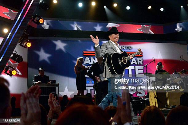Recording artist George Strait performs onstage during ACM Presents: An All-Star Salute To The Troops at the MGM Grand Garden Arena on April 7, 2014...