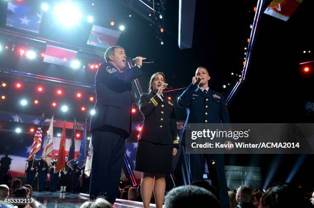 Air Force MSgt. Harry Bounds, Navy Lt. Chelsea Brunoehler and Coast Guard ME1 Noah Reinhart perform onstage during ACM Presents: An All-Star Salute...
