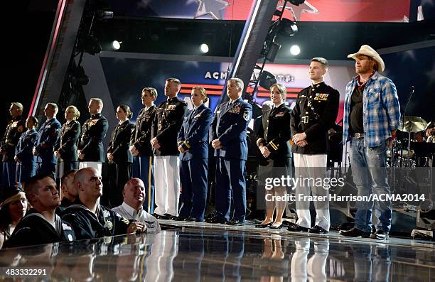 Recording artist Toby Keith speaks onstage with members of the armed forces during ACM Presents: An All-Star Salute To The Troops at the MGM Grand...