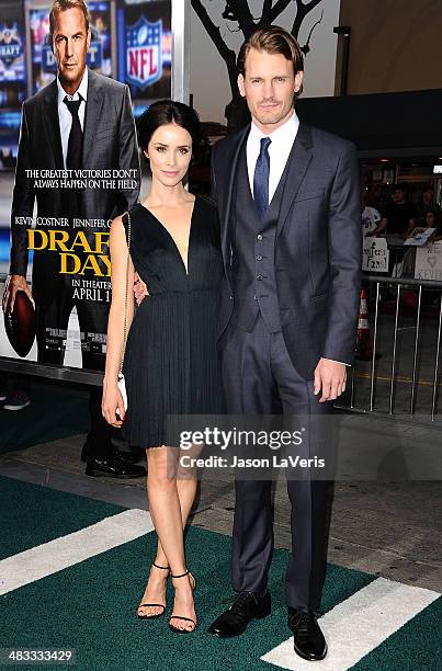 Actress Abigail Spencer and actor Josh Pence attend the premiere of "Draft Day" at Regency Bruin Theatre on April 7, 2014 in Los Angeles, California.