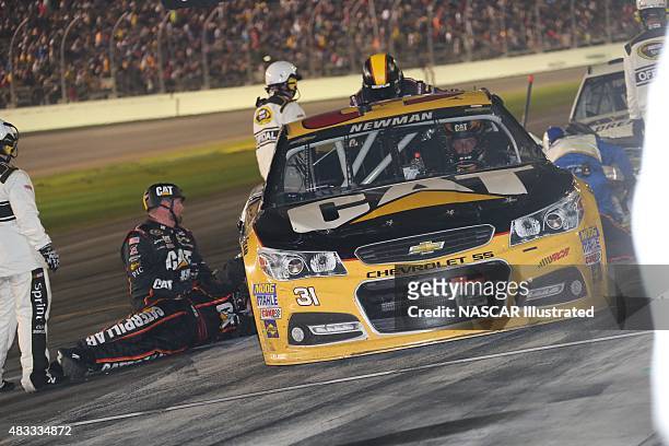 The pit crew for the Caterpillar Chevy SS, driven by Ryan Newman, services the car during the running of the Daytona 500 at the Daytona International...