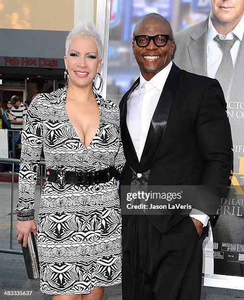 Actor Terry Crews and wife Rebecca Crews attend the premiere of "Draft Day" at Regency Bruin Theatre on April 7, 2014 in Los Angeles, California.