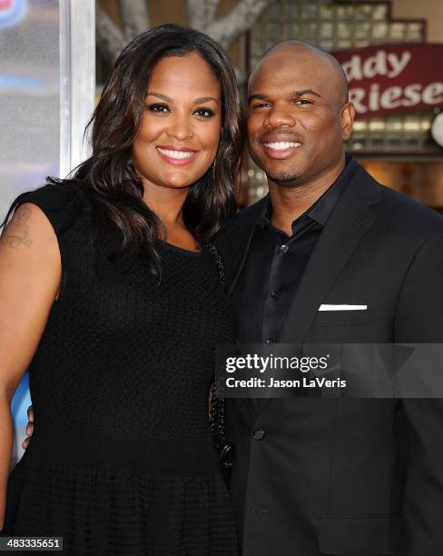 Laila Ali and Curtis Conway attend the premiere of "Draft Day" at Regency Bruin Theatre on April 7, 2014 in Los Angeles, California.