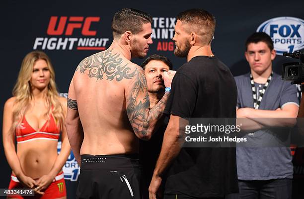 Chris Camozzi and Tom Watson of England face off during the UFC weigh-in at Bridgestone Arena on August 7, 2015 in Nashville, Tennessee.