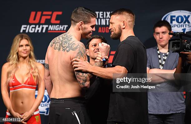 Chris Camozzi and Tom Watson of England face off during the UFC weigh-in at Bridgestone Arena on August 7, 2015 in Nashville, Tennessee.