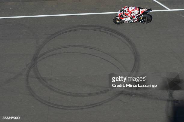 Andrea Dovizioso of Italy and Ducati Team heads down a straight during the MotoGp Red Bull U.S. Indianapolis Grand Prix - Free Practice at...