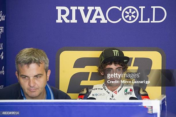 Niccolo Antonelli of Italy and Ongetta Rivacold heads looks on in box during the MotoGp Red Bull U.S. Indianapolis Grand Prix - Free Practice at...