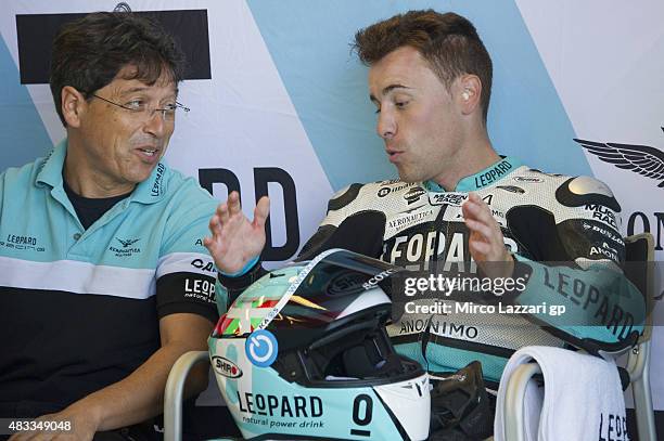 Efren Vazquez of Spain and Leopard Racing speaks in box with mechanic during the MotoGp Red Bull U.S. Indianapolis Grand Prix - Free Practice at...