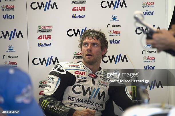 Cal Crutchlow of Great Britain and CWM LCR Honda looks on in box during the MotoGp Red Bull U.S. Indianapolis Grand Prix - Free Practice at...