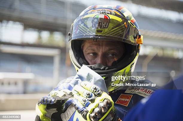 Valentino Rossi of Italy and Movistar Yamaha MotoGP looks on in pit during the MotoGp Red Bull U.S. Indianapolis Grand Prix - Free Practice at...