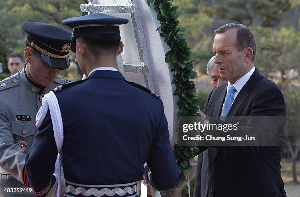 Australian Prime Minister Tony Abbott lays a wreath at Seoul National Cemetery during his visit to South Korea on April 8, 2014 in Seoul, South...