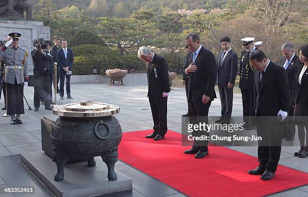 Australian Prime Minister Tony Abbott pays a silent tribute at Seoul National Cemetery during his visit to South Korea on April 8, 2014 in Seoul,...