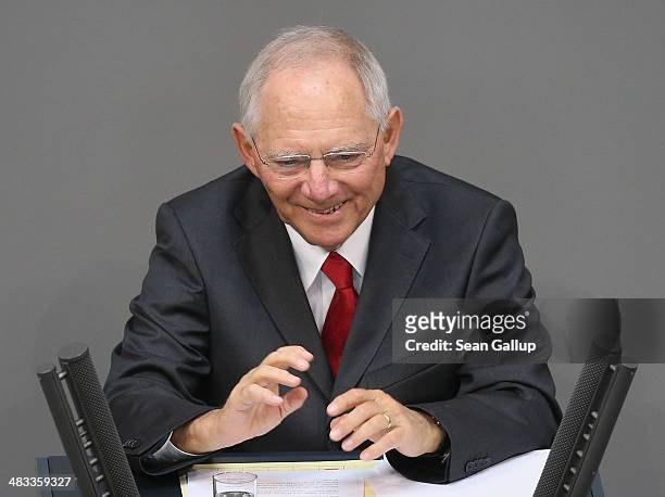 German Finance Minister Wolfgang Schaeuble speaks prior to debates over the government state budget at the Bundestag on April 8, 2014 in Berlin,...