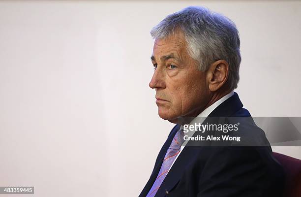 Secretary of Defense Chuck Hagel waits to be introduced prior to his speech at the National Defense University April 8, 2014 in Beijing, China....