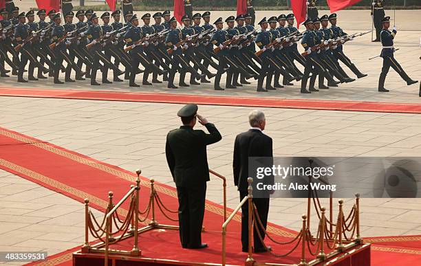 Accompanied by Chinese Minister of Defense Chang Wanquan , U.S. Secretary of Defense Chuck Hagel reviews honor guards during a welcome ceremony at...