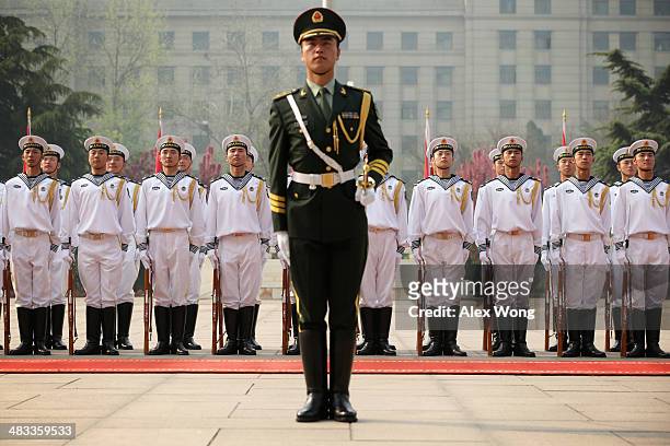 Chinese honor guards wait for the arrival of U.S. Secretary of Defense Chuck Hagel prior to a welcome ceremony at the Chinese Defense Ministry...