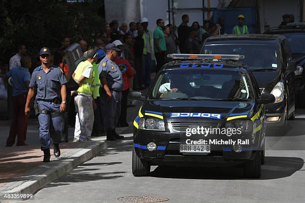 Shrien Dewani leaves the Western Cape High Court in a South African Police cavalcade for Valkenberg Psychiatric Hospital on April 8, 2014 in Cape...