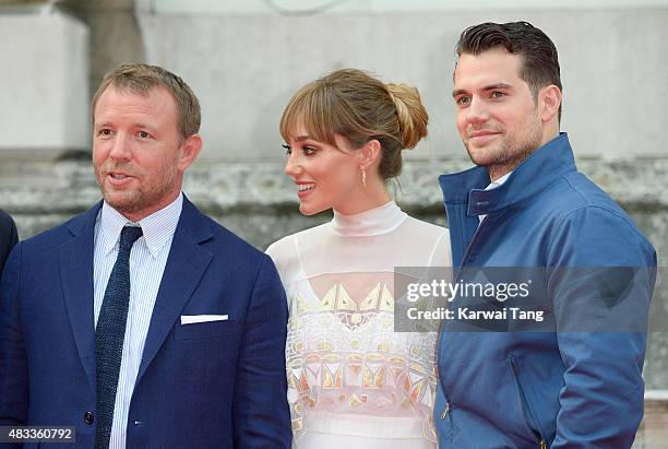 Guy Ritchie, Jacqui Ainsley and Henry Cavill attend the people's premiere of "The Man From U.N.C.L.E" during Film4 Summer Screenings at Somerset...