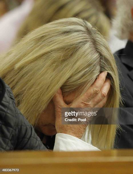 June Steenkamp hides her face as she listens to Oscar Pistorius' testimony in the Pretoria High Court on April 8 in Pretoria, South Africa. Oscar...