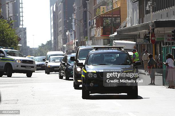 Shrien Dewani arrives at the Western Cape High Court in a South African Police cavalcade after having been succesfully exradited from the United...