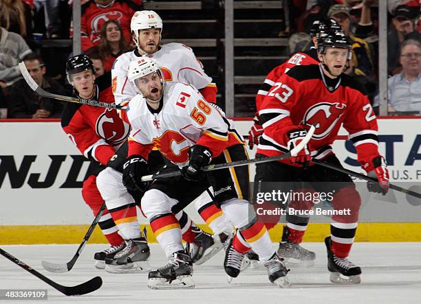 Ben Hanowski of the Calgary Flames skates against the New Jersey Devils at the Prudential Center on April 7, 2014 in Newark, New Jersey. The Flames...