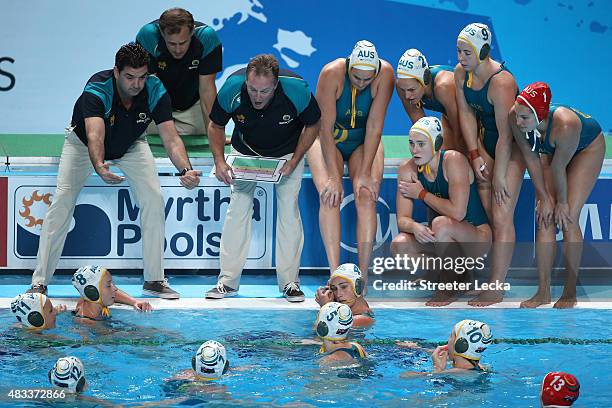 Head Coach Gregory McFadden of Australia gives a team talk in the Women's bronze medal match between Australia and Italy on day fourteen of the 16th...