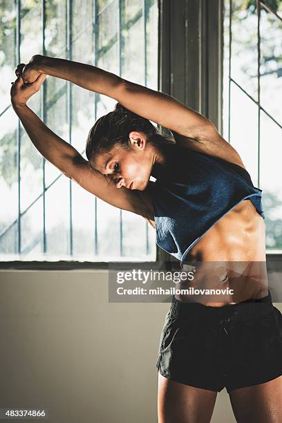 stretching - flat stomach stock pictures, royalty-free photos & images