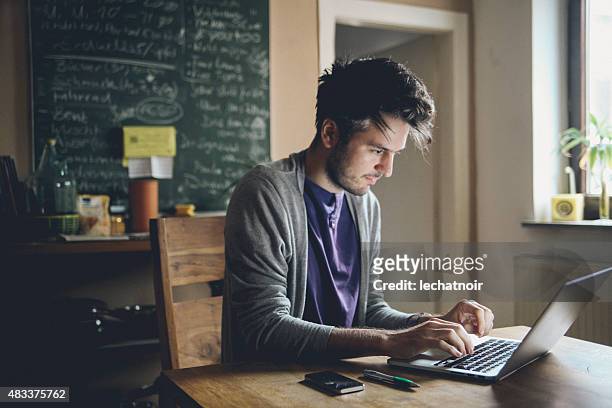 typing on the laptop computer - author stock pictures, royalty-free photos & images