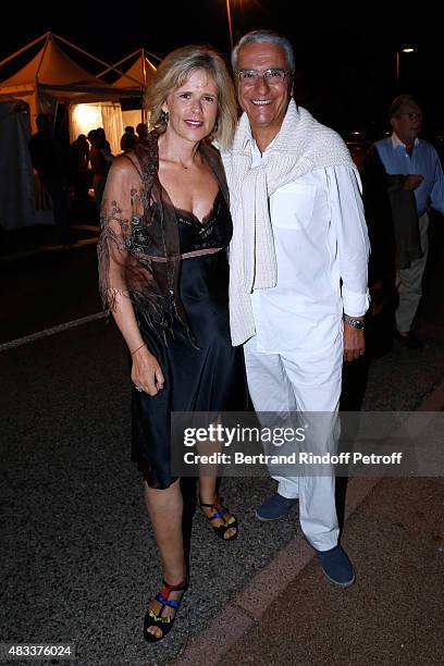 Journalist Norbert Balit and his wife Journalist Laurence Piquet attend the 'La colere du Tigre' Theater play during the 31th Ramatuelle Festival :...