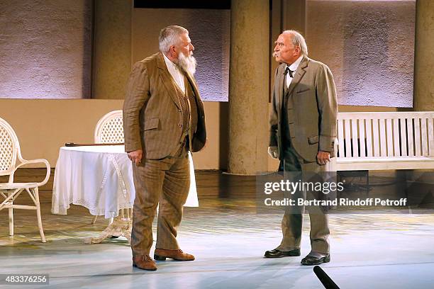 Actors Yves Pignot and Claude Brasseur perform in the 'La colere du Tigre' Theater play during the 31th Ramatuelle Festival : Day 6 on August 6, 2015...