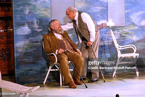Actors Yves Pignot and Claude Brasseur perform in the 'La colere du Tigre' Theater play during the 31th Ramatuelle Festival : Day 6 on August 6, 2015...