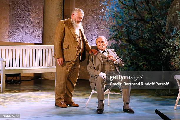 Actors Yves Pignot and Claude Brasseur perform in the 'La colere du Tigre' Theater play during the 31th Ramatuelle Festival : Day 6 on August 6, 2015...