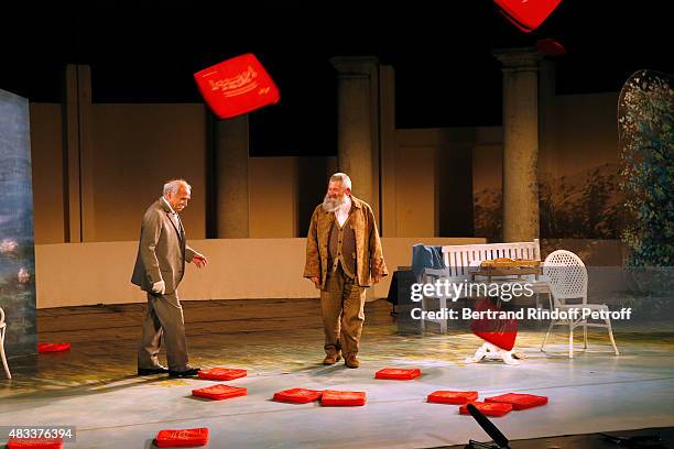 Actors Claude Brasseur and Yves Pignot acknowledge the applause of the audience whyle the traditional throw of cushions at the final of the 'La...