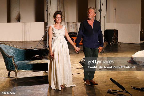 Actors Marie Gillain and Nicolas Briancon acknowledge the applause of the audience at the end of the 'La Venus a la Fourrure' Theater play during the...