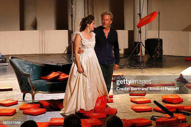 Actors Marie Gillain and Nicolas Briancon acknowledge the applause of the audience whyle the traditional throw of cushions at the final of the 'La...