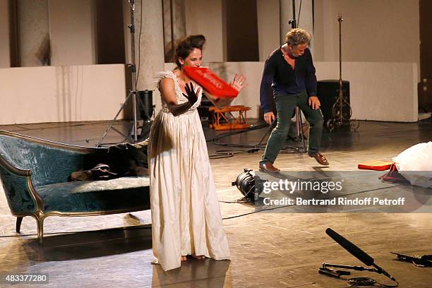 Actors Marie Gillain and Nicolas Briancon acknowledge the applause of the audience whyle the traditional throw of cushions at the final of the 'La...
