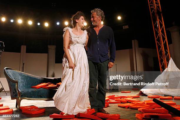 Actors Marie Gillain and Nicolas Briancon acknowledge the applause of the audience whyle the traditional throw of cushions at the final of the 'La...