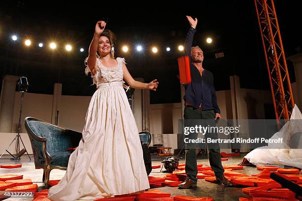 Actors Marie Gillain and Nicolas Briancon acknowledge the applause of the audience whyle the traditional throw of cushions at the final of the 'La...