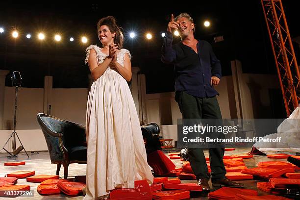 Actors Marie Gillain and Nicolas Briancon acknowledge the applause of the audience whyle the traditional throw of cushions at the final of the 'La...