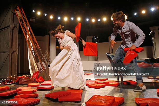 Actors Marie Gillain and Stage Director Jeremie Lippmann play with cushions whyle the traditional throw of cushions at the final of the 'La Venus a...