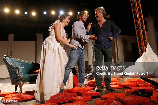 Actors Marie Gillain, Stage Director Jeremie Lippmann and Nicolas Briancon acknowledge the applause of the audience whyle the traditional throw of...