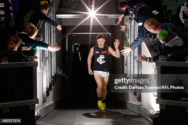 Carlton captain Marc Murphy walks up the race after the half time break during the round 19 AFL match between the Collingwood Magpies and Carlton...