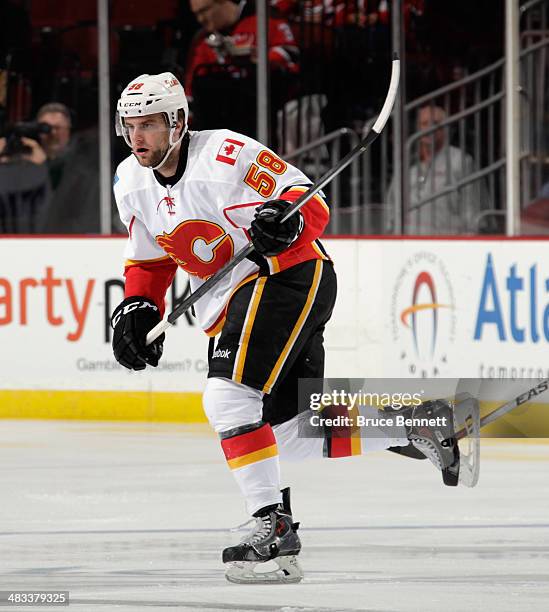 Ben Hanowski of the Calgary Flames skates against the New Jersey Devils at the Prudential Center on April 7, 2014 in Newark, New Jersey. The Flames...