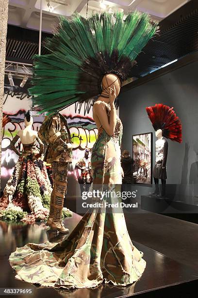 Designs by Jean Paul Gaultier on display during a press view of The Fashion World Of Jean Paul Gaultier: From Sidewalk To The Catwalk at Barbican Art...