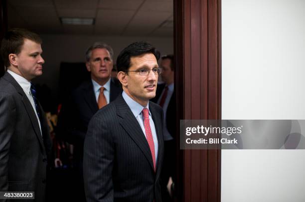 House Majority Leader Eric Cantor, R-Va., followed by Majority Whip Kevin McCarthy, leaves the House Republican Conference meeting to speak to the...