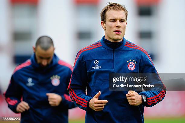 Holger Badstuber and Diego Contento of FC Bayern Muenchen in action during a training session ahead of their UEFA Champions League quarter-final...