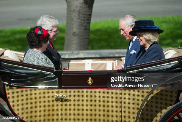 Prince Charles Prince of Wales, Camilla, Duchess of Cornwall and Irish Foreign Minister Eamon Gilmore leave the ceremonial welcome for the Irish...
